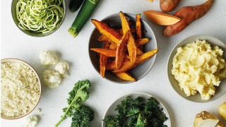 Cauliflower Rice, Courgette Spaghetti, Sweet Potato Wedges, Kale Crisps and Celeriac Mash served in separate bowls