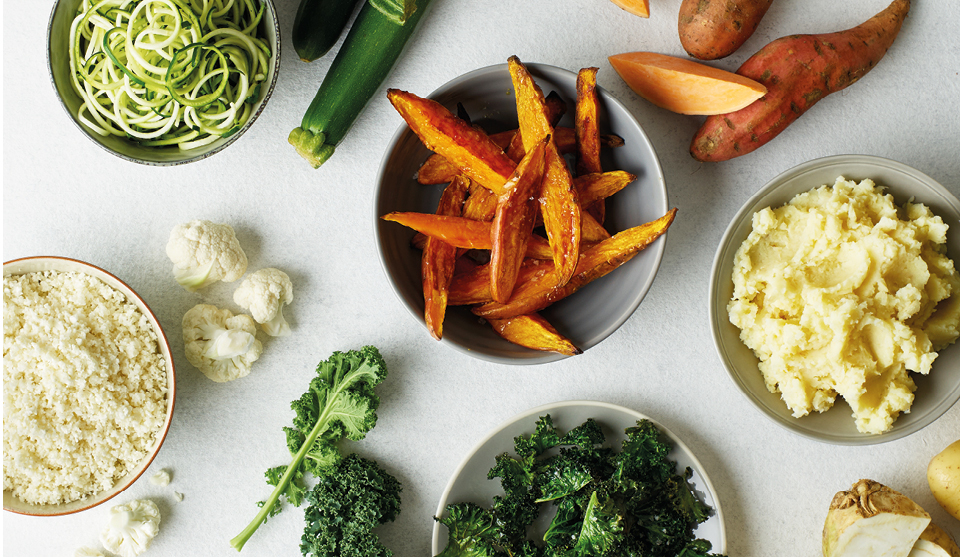 Cauliflower Rice, Courgette Spaghetti, Sweet Potato Wedges, Kale Crisps and Celeriac Mash served in separate bowls