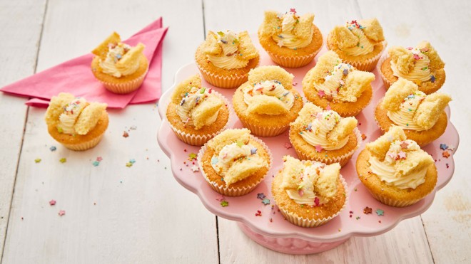 Helen's Mum's Butterfly Buns served on a pink plate with star shaped sprinkles