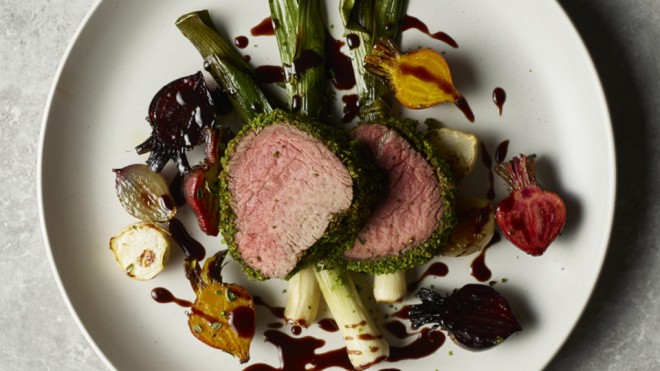 Herb Crusted Filled of Beef served on a white plate with roasted beetroot and red wine sauce