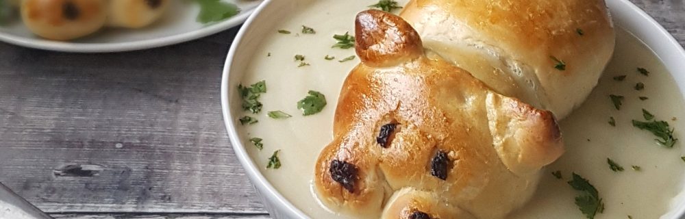 Hungry Hippo Soup Rolls with sultanas for noses sitting in a bowl of soup