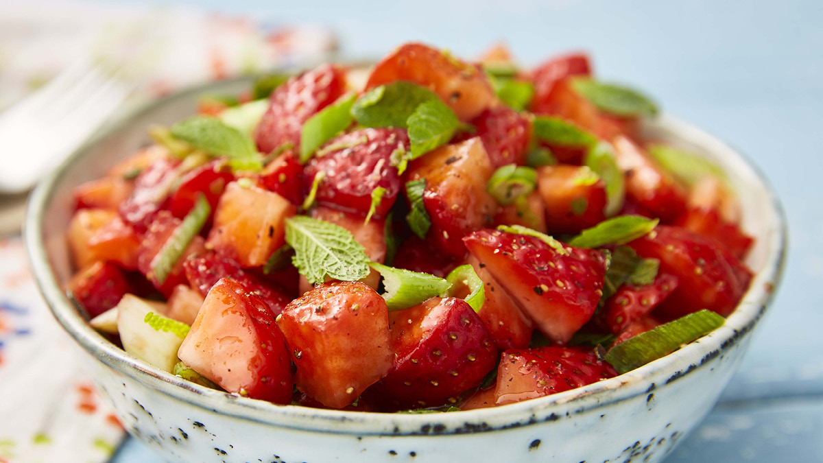 Strawberry Salsa served in a white bowl with mint leaves