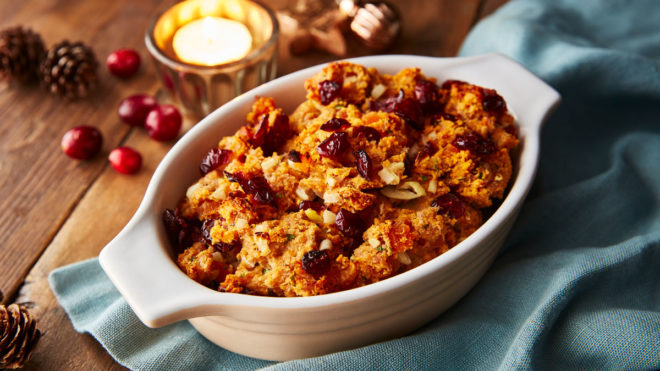 John Gill's Easy Festive Stuffing served in a white baking dish