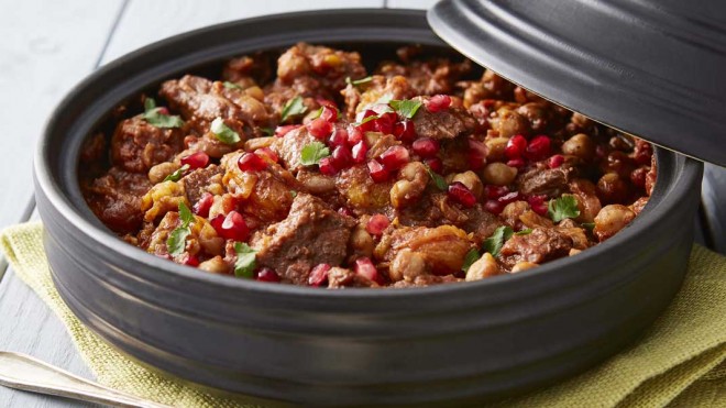 Lamb served in a grey tagine with cous cous and pomegrante pearls