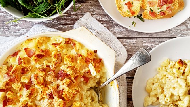 Lancashire Macaroni Cheese served in a white dish with a portion removed