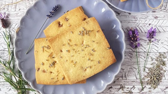 White Chocolate and Lavender Shortbread served on a purple plate surrounded by sprigs of lavender