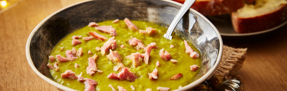 Leftover Gammon and Pea Soup, served in a grey bowl with a portion of buttered bread