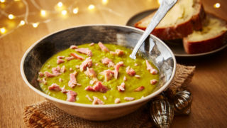 Leftover Gammon and Pea Soup, served in a grey bowl with a portion of buttered bread