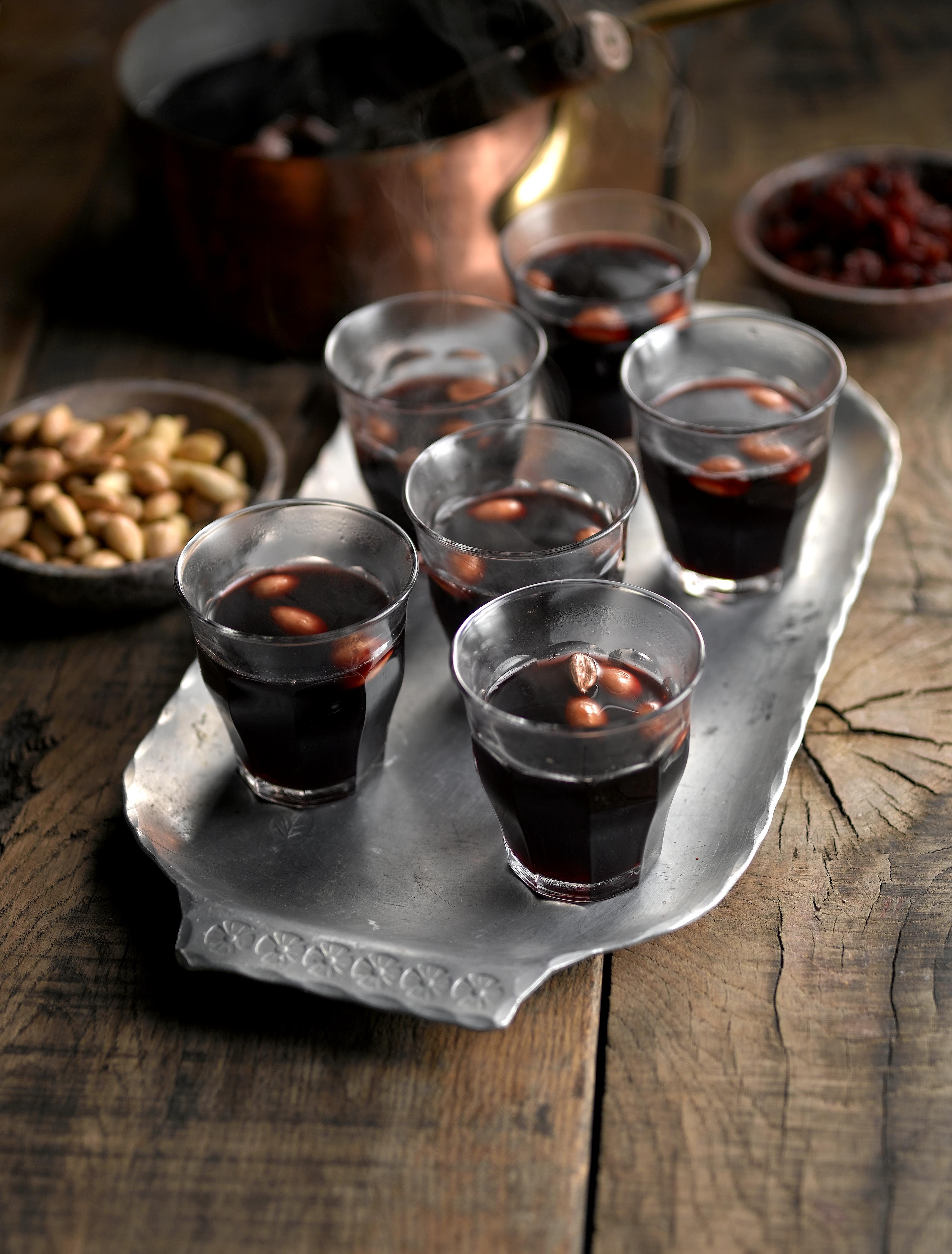 Scandinavian Spiced Mulled Wine served in six glasses with almonds in the glasses