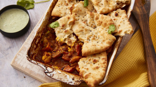 Naan Topped Chicken Tikka Pie served in a white baking dish