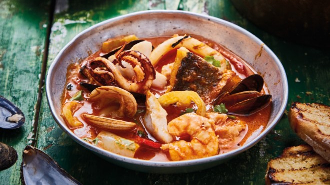 Brazilian Seafood Stewserved on a bowl with toasted ciabatta on the side