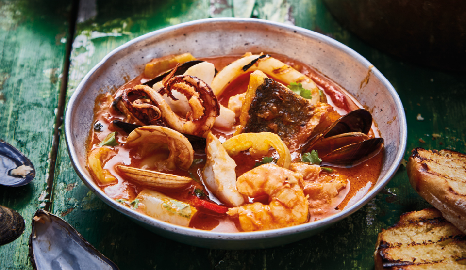 Brazilian Seafood Stewserved on a bowl with toasted ciabatta on the side