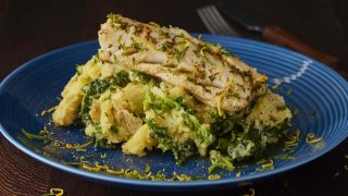 Pan Fried Meagre in Lemon and Thyme Citrus Butter served on a blue plate