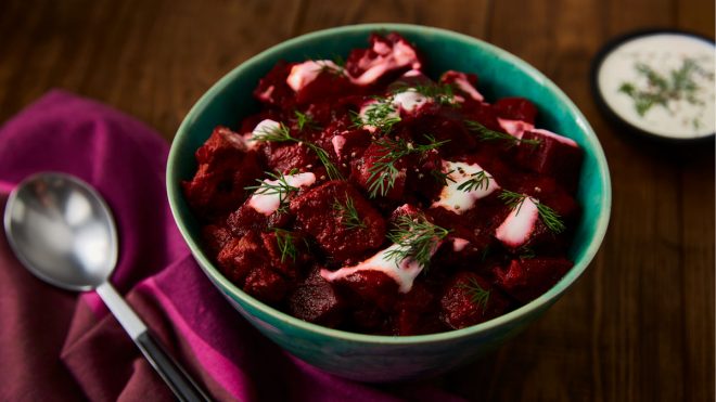 Paprika Beef and Beetroot Goulash topped with dill served in a turquoise bowl