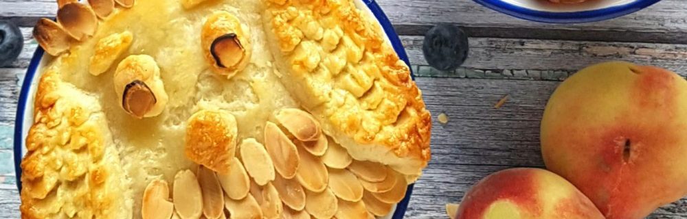 Peach, Plum and Almond Owl Pie with the pastry and almonds arranged to make the topping look like an owl