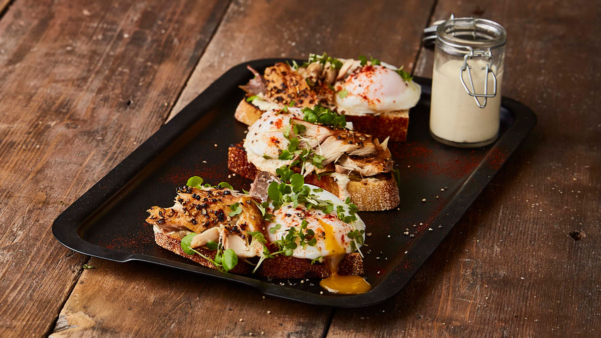 Posh Peppered Mackerel and Poached Egg on Toast served on a baking tray