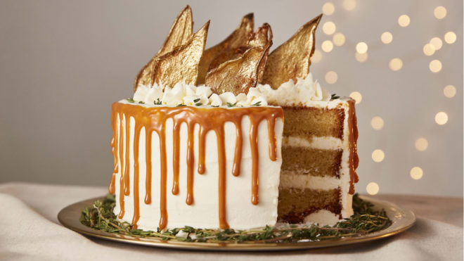 Prosecco, Pear and Elderflower Cake served on a gold serving plate