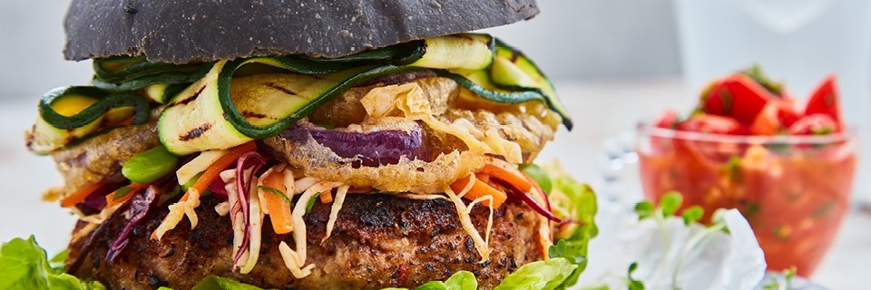 Spicy Pinto Bean Burgers served on a charcoal brioche bun