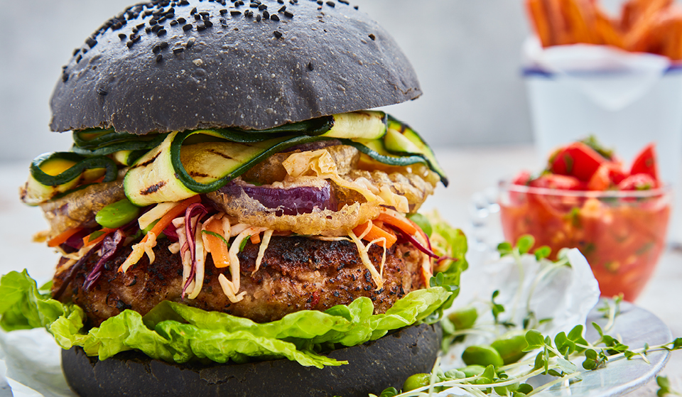 Spicy Pinto Bean Burgers served on a charcoal brioche bun