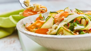 Orzo Pasta Salad served in a white bowl