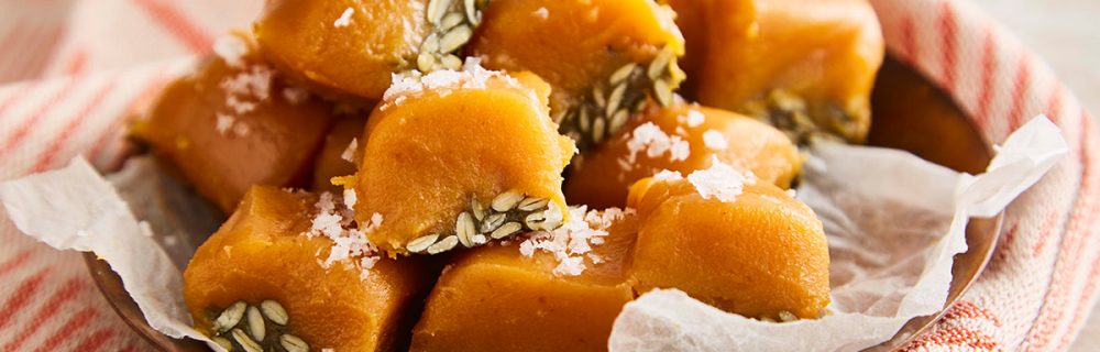 Salted Caramel Pumpkin Fudge served on baking parchment on top of a plate