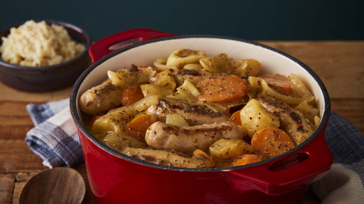 Slow Cooker Sausage Casserole served in a casserole dish on top of a wooden table