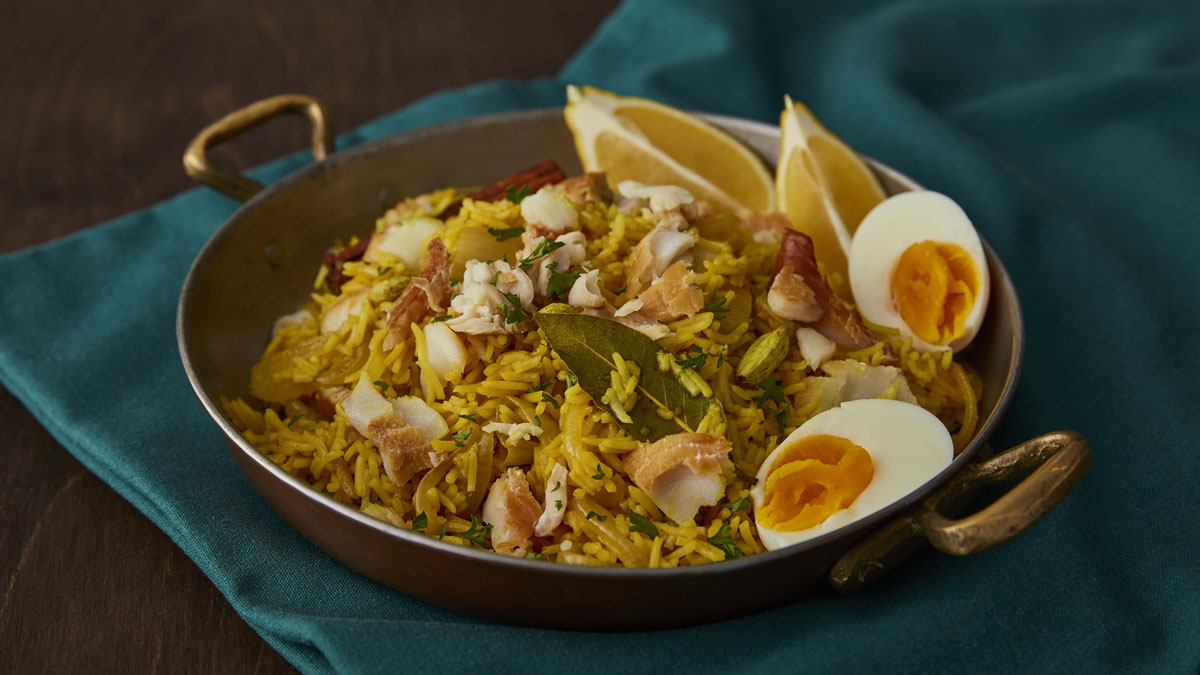 Smoked Haddock Kedgeree served in a small skillet on top of a blue tablecloth