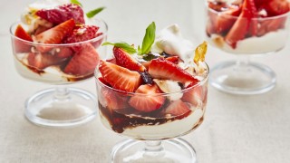 Strawberries with Black Olive Balsamic Caramel served in glass dishes with cream