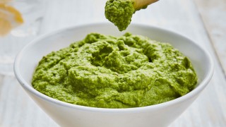Supergreen Houmous served in a white bowl