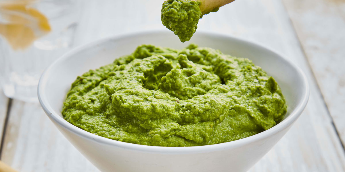 Supergreen Houmous served in a white bowl