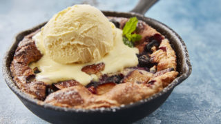 Fruity Yorkshire Pudding served in a skillet pan, topped with ice cream