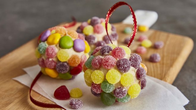 Jewelled Edible Christmas Baubles served on a wooden board