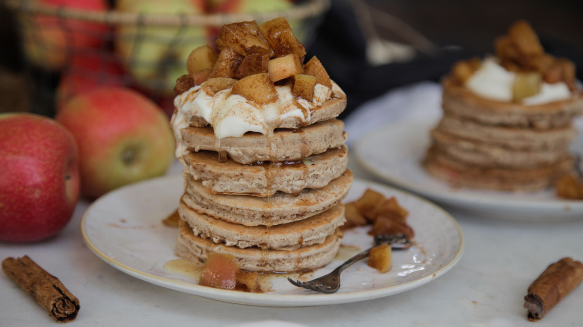 Apple Pie Pancakes served in a stack on a rustic style plate