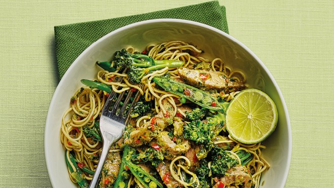 Thai Beef and Broccoli Stir Fry served in a white bowl with a wedge of lime