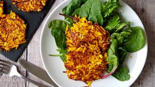 Spicy Pumpkin Fritters served on a bed of green leaves