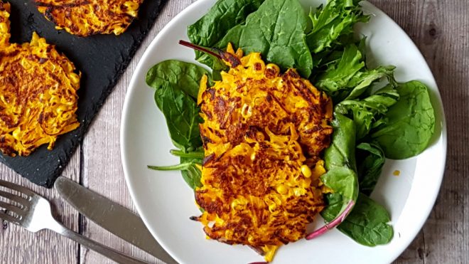 Spicy Pumpkin Fritters served on a bed of green leaves