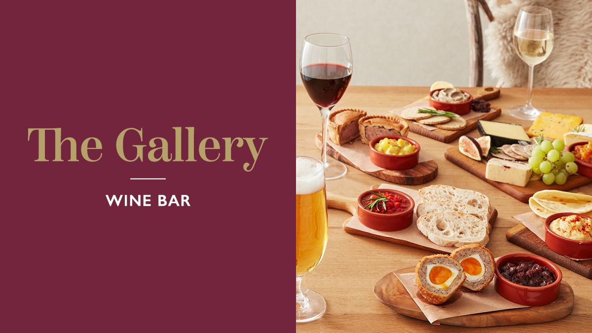 The Gallery Wine Bar. A table of tapas with glasses of wine and beer.
