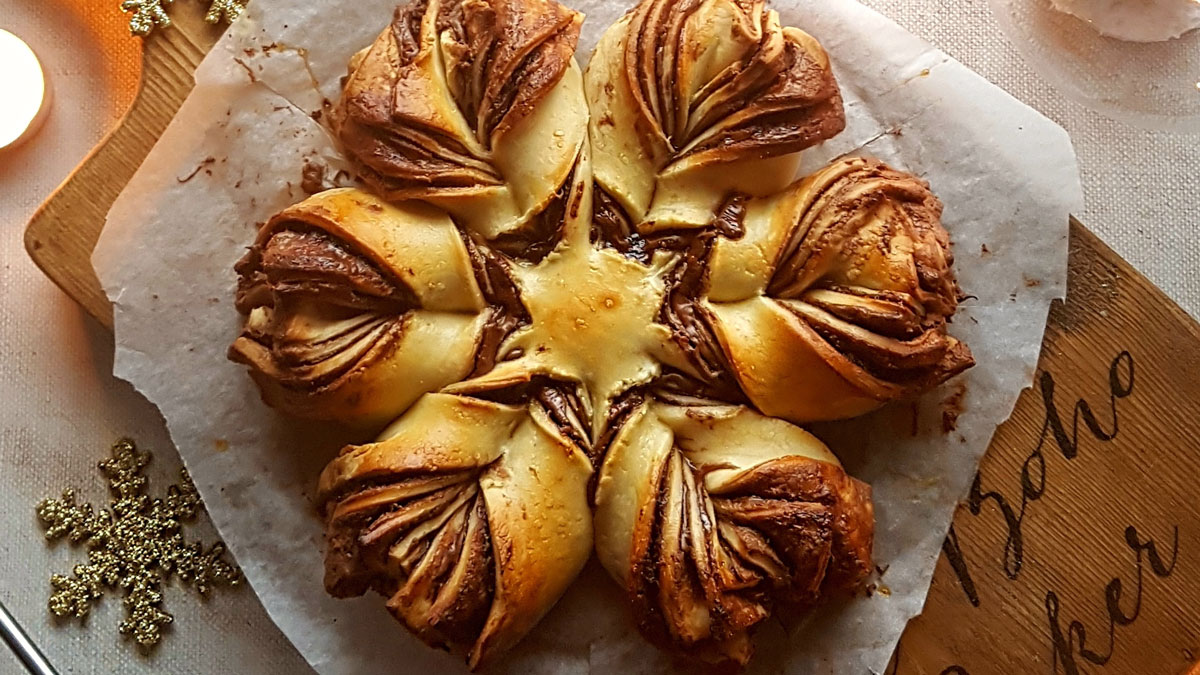 Chocolate Orange Snowflake Bread served on a wooden board