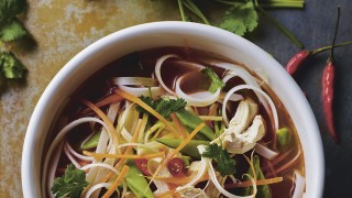 Hot and Sour Turkey Noodle Broth served in a white bowl