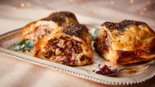 Turkey, Stuffing and Cranberry Sausage Rolls served on a white tray