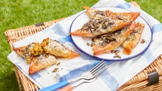 Veggie Picnic Parcels served on a plate on top of a picnic hamper