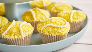 Coconut and Lime Tennis Ball Cupcakes served on a blue plate