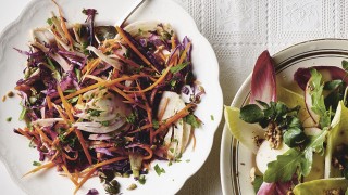 Winter Slaw served in a white dish with a spoon